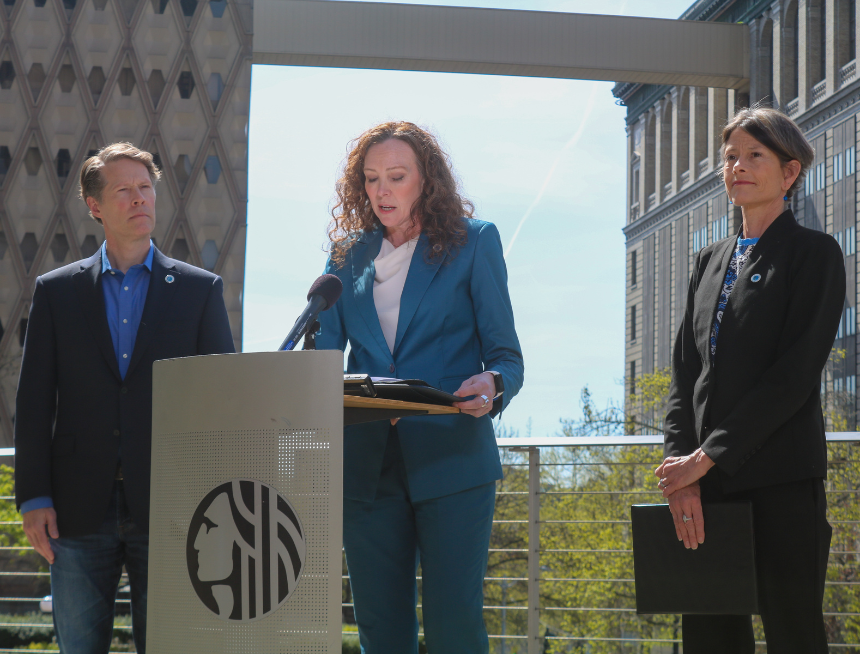 Seattle Councilmember Alex Pedersen and Sara Nelson stand with City Attorney Ann Davison during a press conference in front of City Hall.