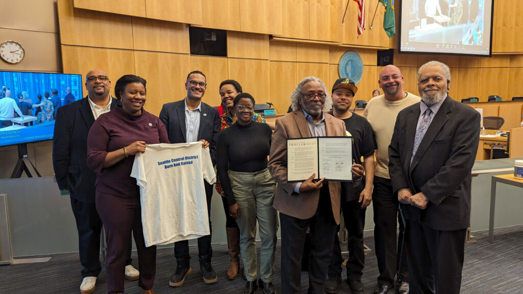Seattle City Councilmember Rob Saka and Joy Hollingsworth deliver a proclamation declaring February Black History Month in Seattle. 