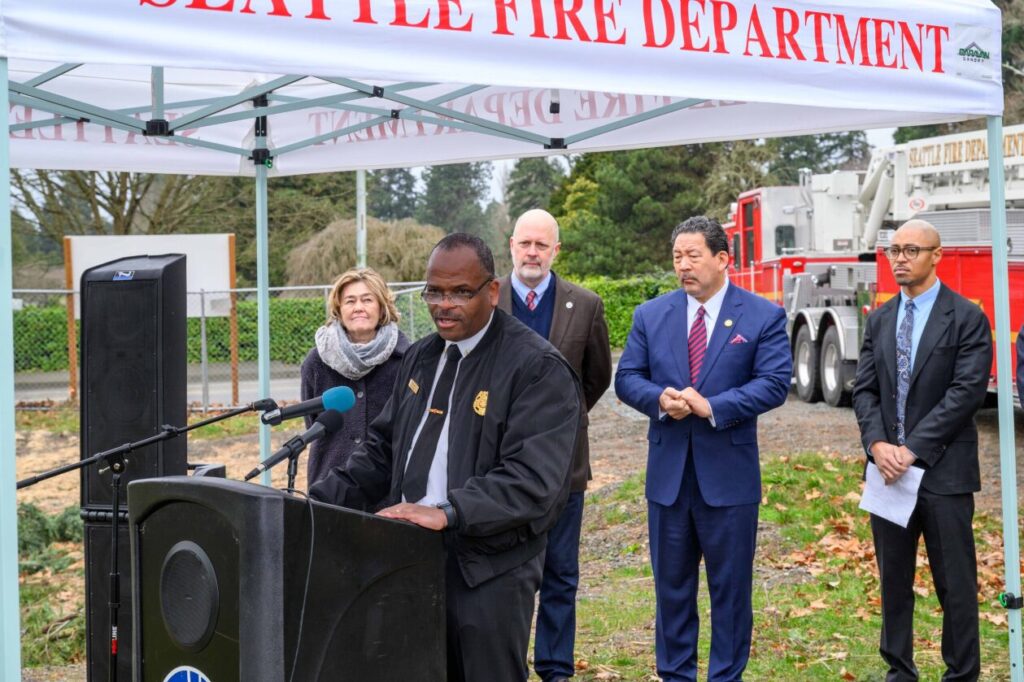 Seattle City Councilmembers Bob Kettle, Cathy Moore, Mayor Bruce Harrell, Fire Chief Scoggins and others at the groundbreaking for a new fire station. 