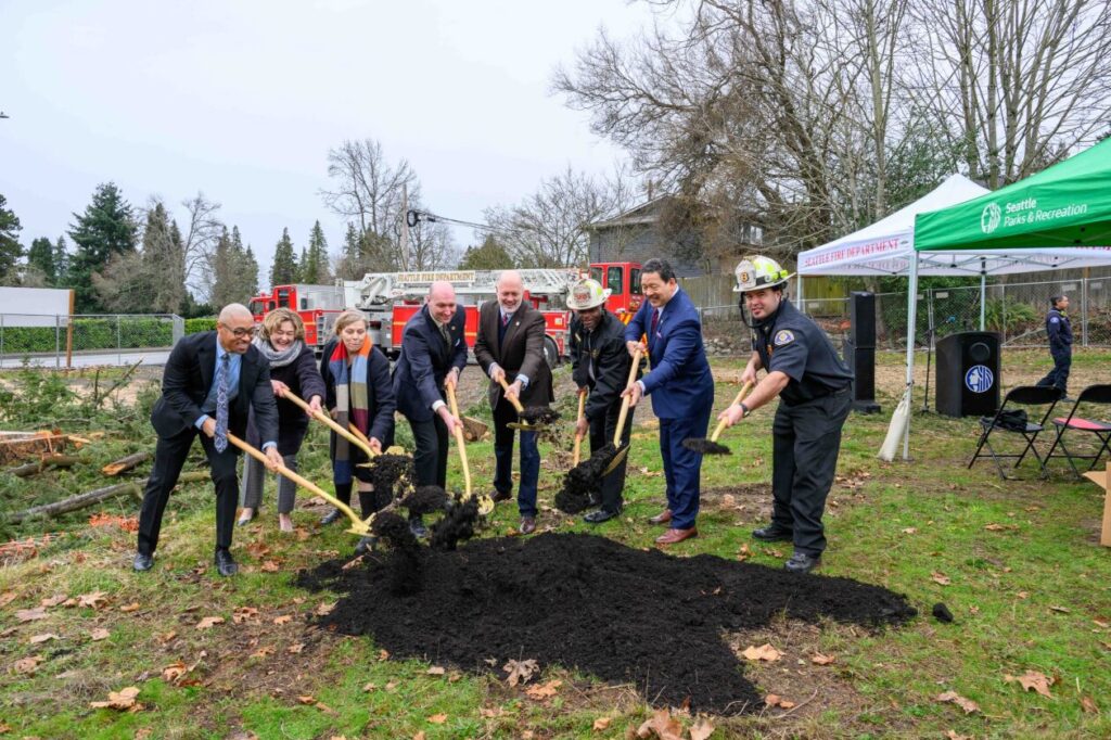 Seattle City Councilmembers Bob Kettle, Cathy Moore, Mayor Bruce Harrell, Fire Chief Scoggins and others at the groundbreaking for a new fire station. 