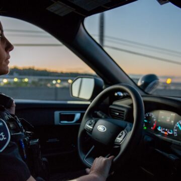 Police officer driving.