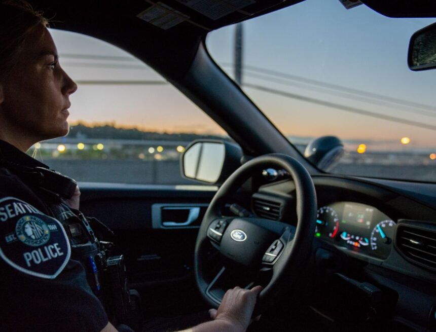 Police officer driving.