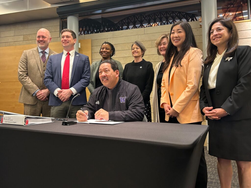 Councilmember Strauss and other Councilmembers attend bill signing for 2025-2026 budget by Mayor Bruce Harrell. 