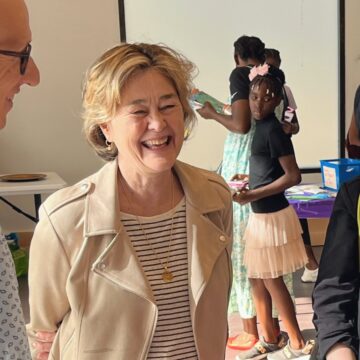 Councilmember Moore smiling while conversing with constituents