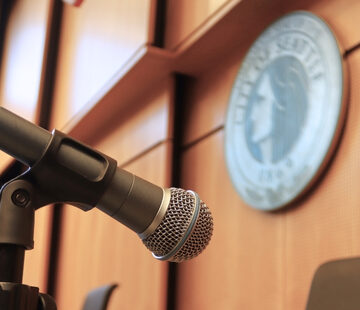 microphone at Seattle City Hall Chambers, the official City of Seattle seal can be seen in the background
