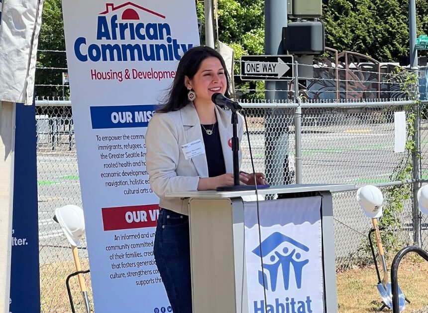 Rinck_9.23.25 Release Councilmember Rinck speaking at a podium with the Habitat for Humanity logo