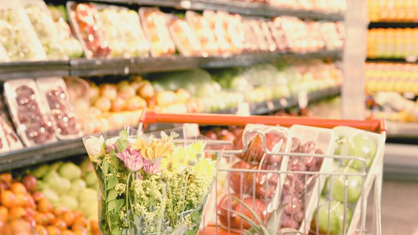 Grocery-Store fresh produce in a grocery cart in a grocery store aisle