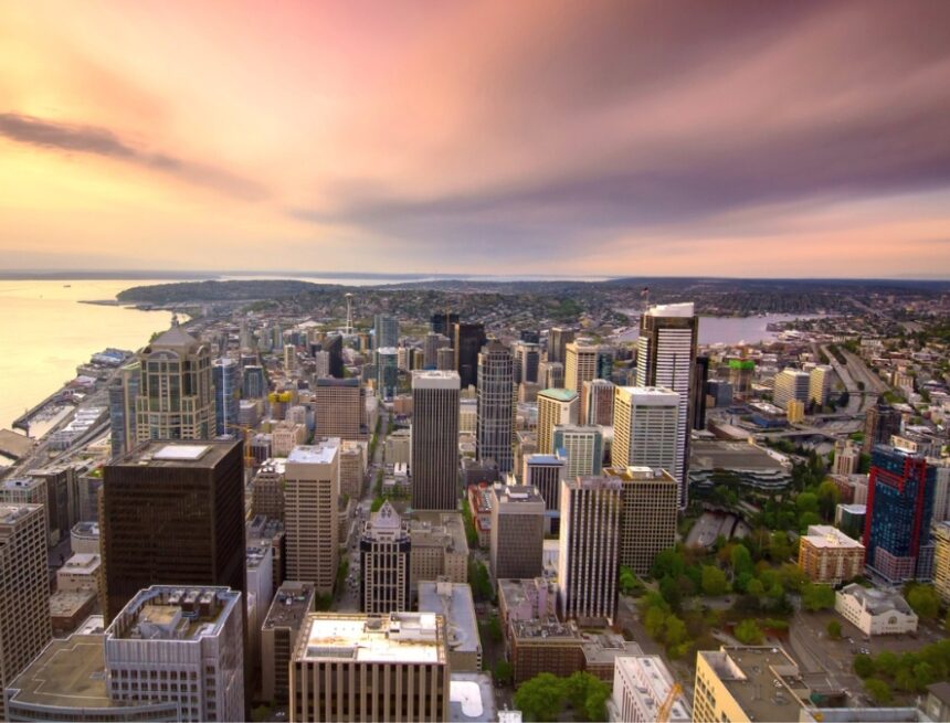 Seattle-Aerial-at-Sunset aerial view over Seattle downtown and beyond at sunset