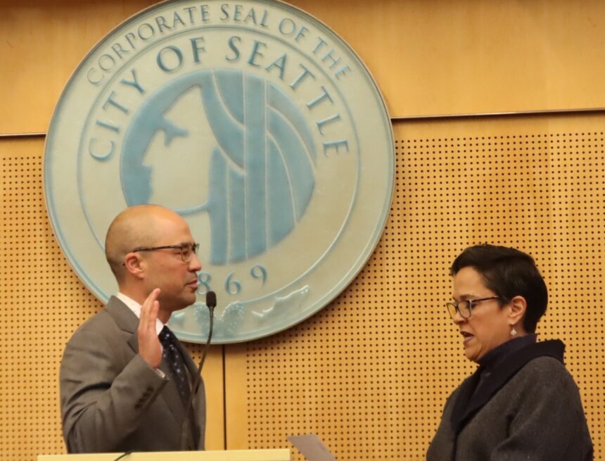 Councilmember Eddie Lin is sworn in.