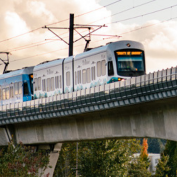 Light Rail Train on a overpass at sunset