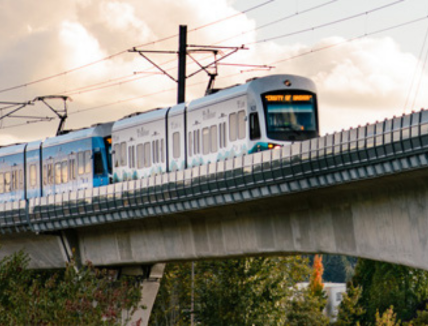 Light Rail Train on a overpass at sunset