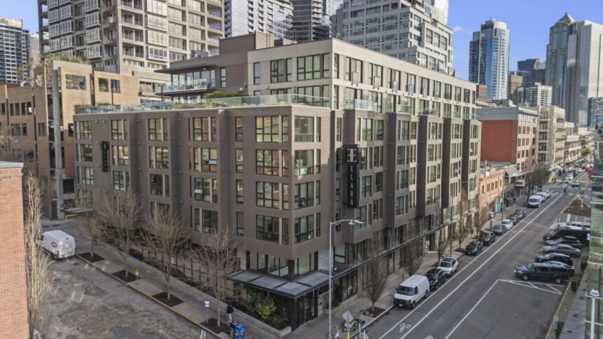 building on a corner with a sign that reads "Elara"