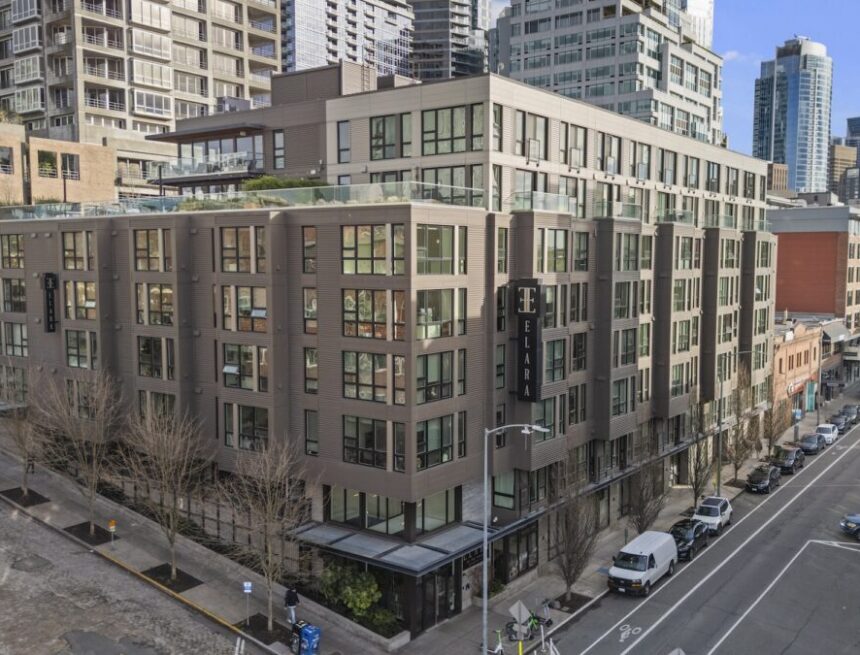 building on a corner with a sign that reads "Elara"