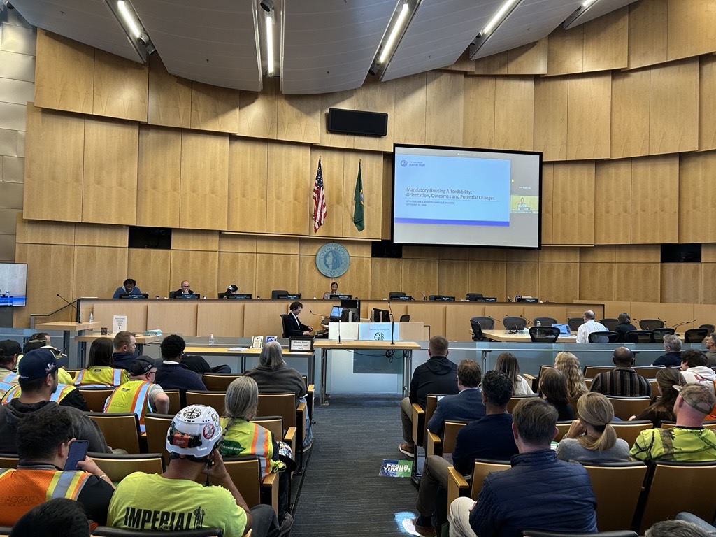 Seattle City Council Chambers filled with people, many in safety vests